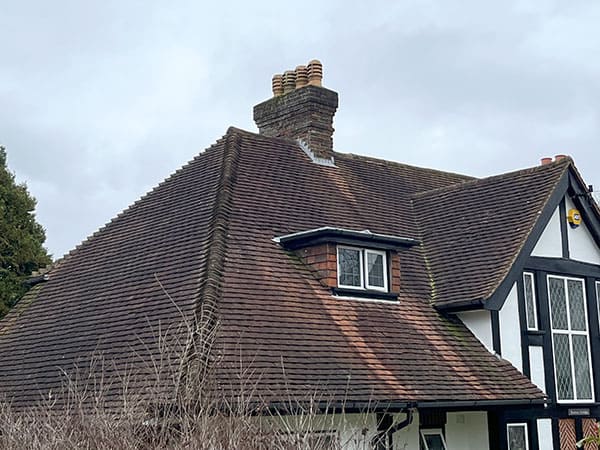 Photo showing a chimney pot repair on a house in Haringey